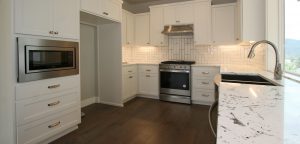 Barclay Kitchen with Wood Floors, Beautiful Cabinets, Granite Slab Counters and High Quality Stainless Appliances